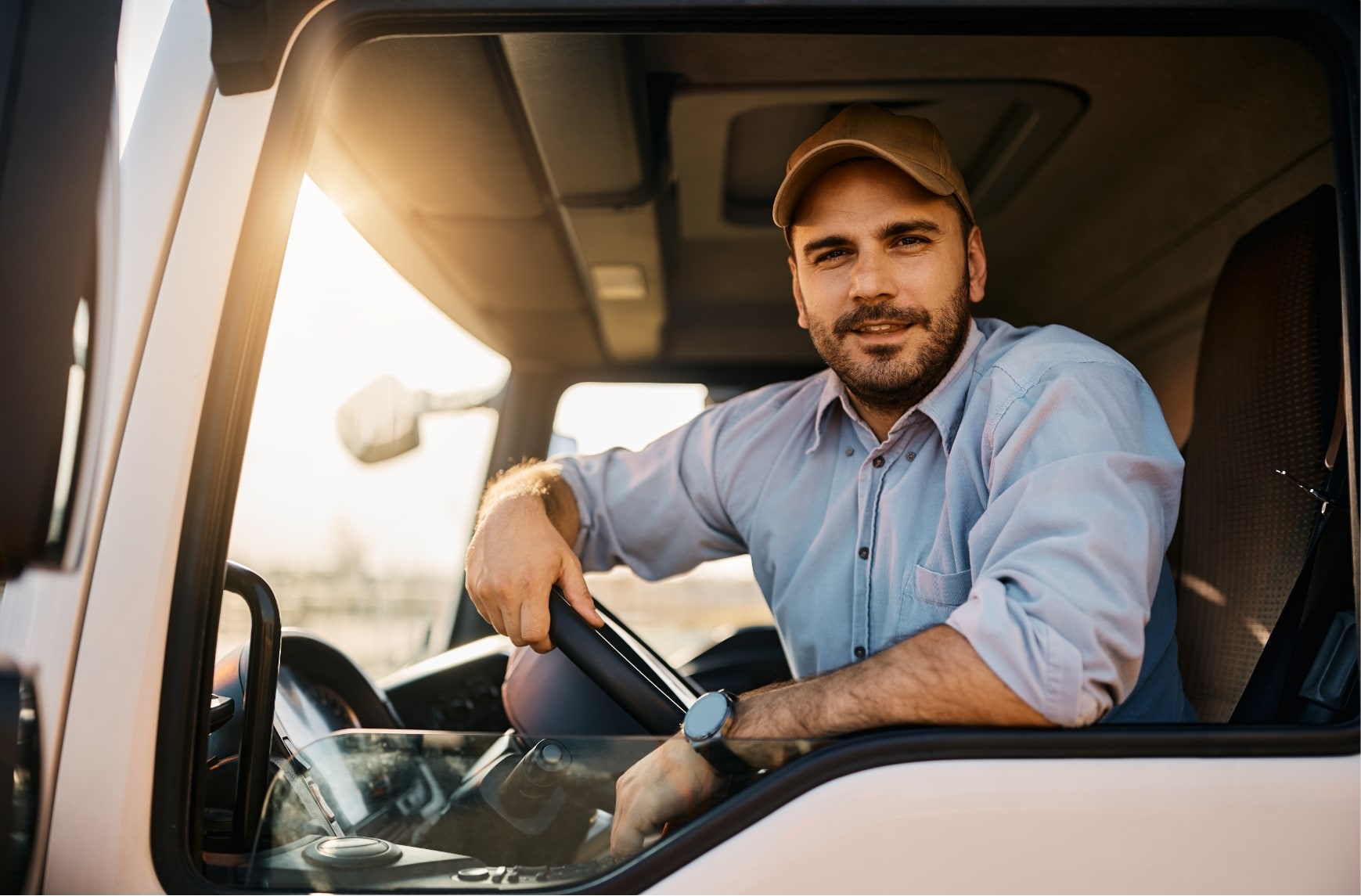 A delivery driver in a heavy goods vehicle.